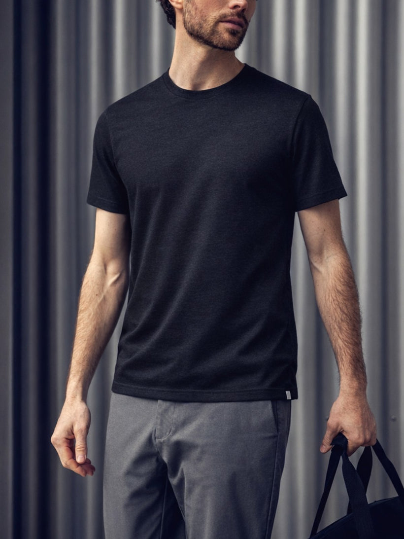 Men's Travel Merino Tee in Black, worn on model